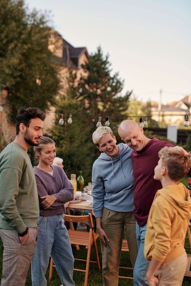 Family talking in the backyard on a summer evening