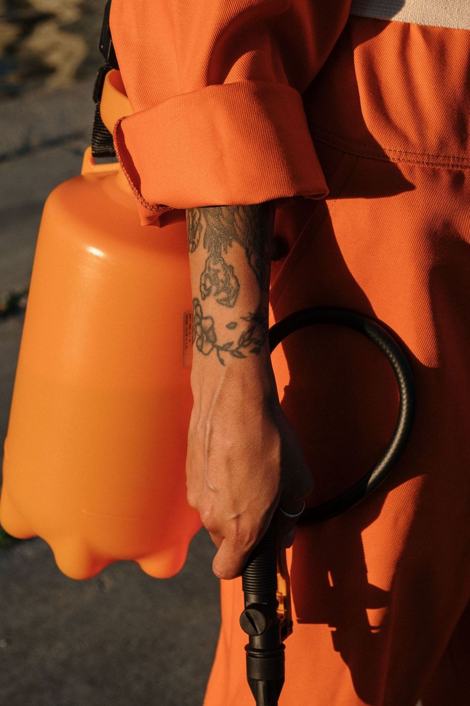 Pest control technician with a pump sprayer
